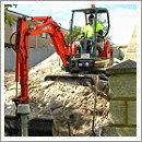 excavator breaking rock